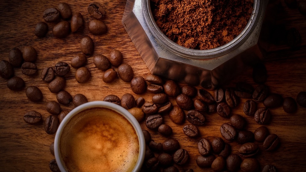 How is caffeine extracted from coffee beans?